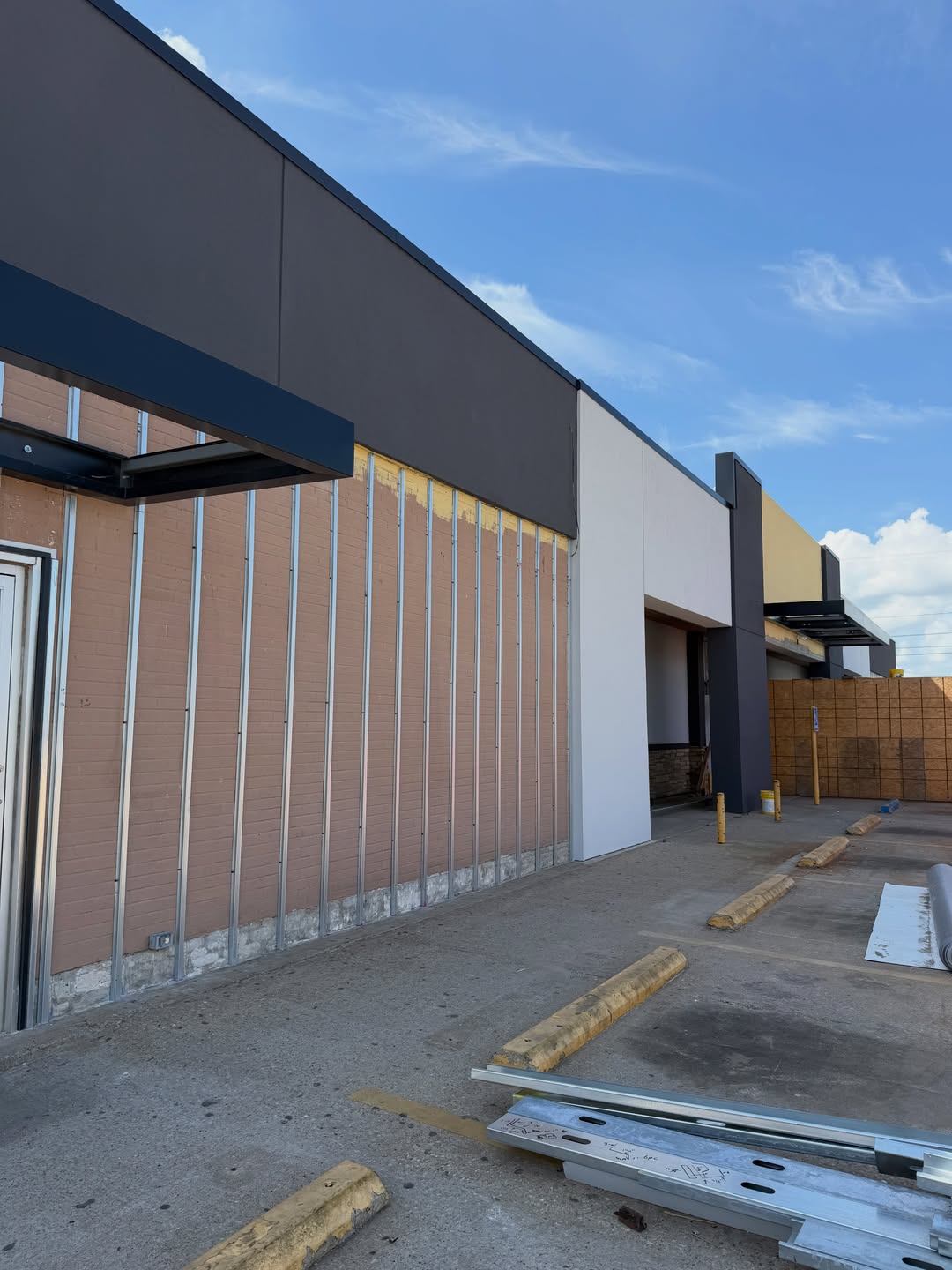 Commercial storefront prepped with lath for stucco